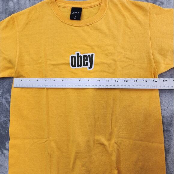 Vintage OBEY Top Womens M Mustard Yellow Boxy Crop Logo Graphic Tee Casual - Picture 6 of 8